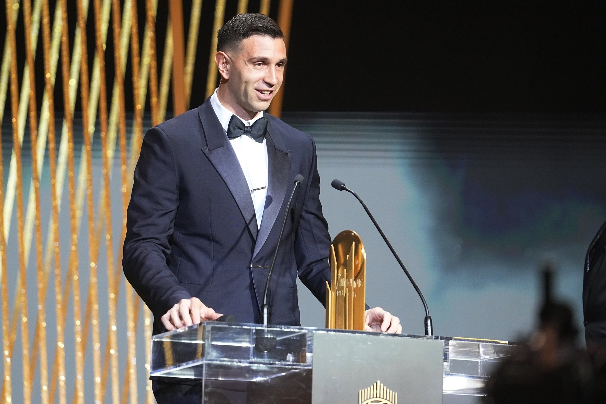 Aston Villa's and Argentina's national team goalkeeper Emiliano Martinez receives the Yashin trophy during the 67th Ballon d'Or (Golden Ball) award ceremony at Theatre du Chatelet in Paris, France, Monday, Oct. 30, 2023. (AP Photo/Michel Euler)